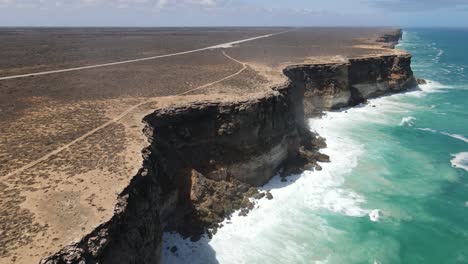 Drone-aerial-moving-backwards-over-the-Great-Australian-Bight-showing-crashing-waves