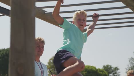 Caucasian-boy-training-at-boot-camp-