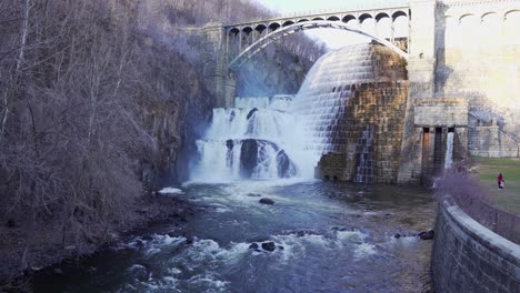 people at waterfall of new croton dam in westchester county, new york