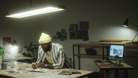 a man working diligently at his desk in a modern office