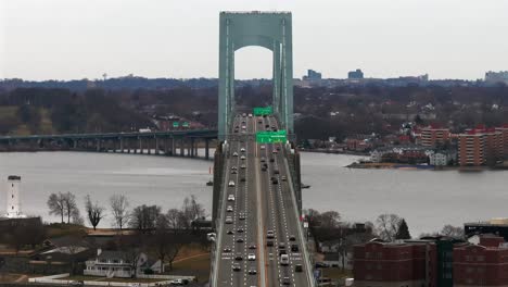 An-aerial-view-of-the-Throgs-Neck-Bridge-from-over-the-Long-Island-Sound,-NY-on-a-cloudy-day