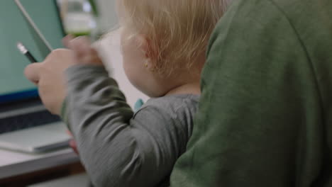 close-up-caucasian-business-woman-mother-holding-baby-discussing-corporate-project-with-colleagues-multitasking-in-modern-office-workplace