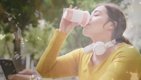 Animation-of-spots-of-light-over-caucasian-woman-drinking-take-away-coffee-in-city-street