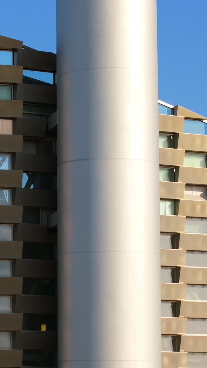 Aerial drone view of CopenHill artificial ski slope on the roof of an energy plant. Vertical