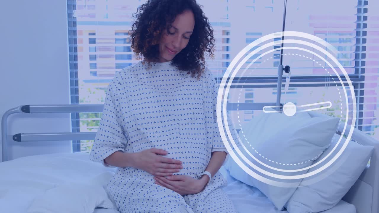 Fast moving clock over happy pregnant biracial woman rubbing belly in hospital room