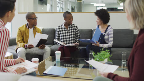 diverse group of male and female business colleagues working in office