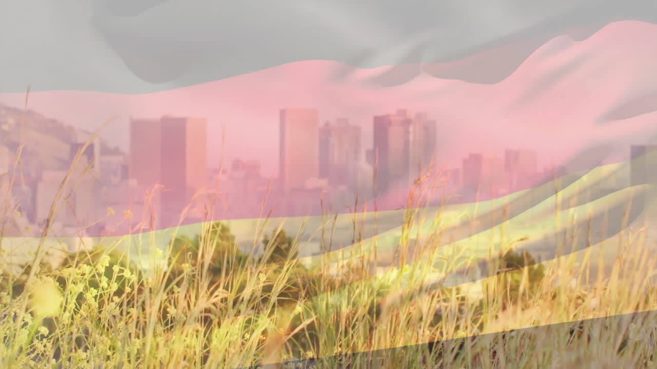City skyline with animation of flag overlay and tall grass in foreground