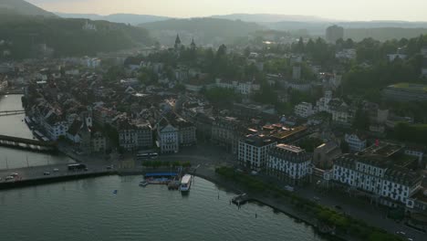 Wide shot of lakefront road and bridge connecting both sides of Lucerne’s old town
