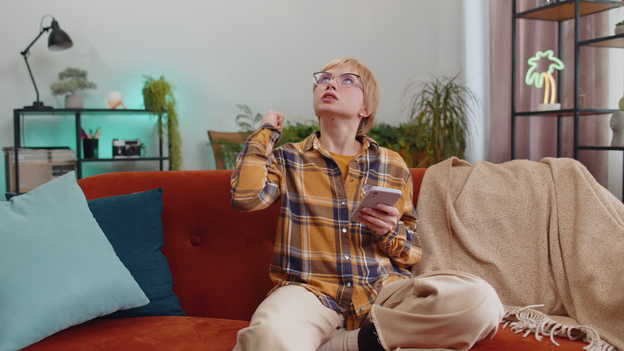 Repair work at neighbours concept irritated woman at home cover ears with pillows annoyed by noise