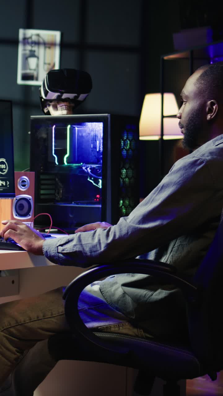 Vertical video Man arriving at home to play FPS videogame on PC screen