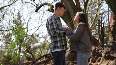 couple holding hands in a park