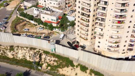aerial view of urban area with separation barrier and apartment buildings