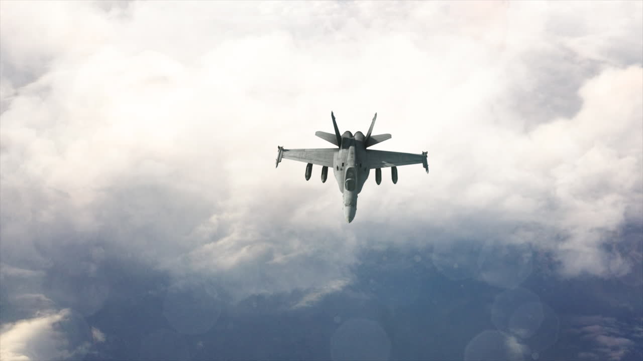 4k Aerial Jet Fighter F-18 flies above clouds