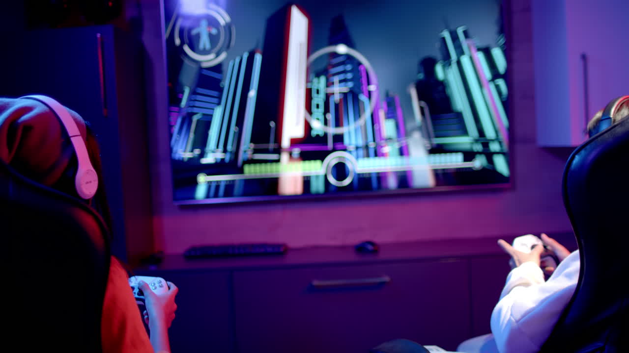 Playing video game, two teenage girls using controllers and wearing headphones, copy space