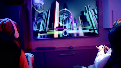 playing video game, two teenage girls using controllers and wearing headphones, copy space
