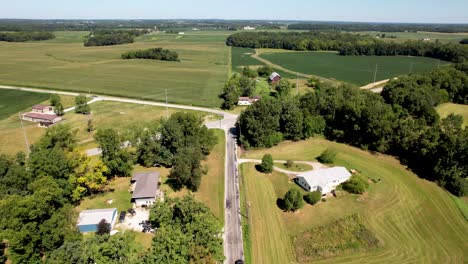 midwest countryside- aerial fly over with roads, houses and farm fields