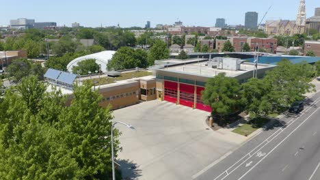 Aerial-Establishing-Shot-of-Urban-Firehouse-in-Downtown-Chicago