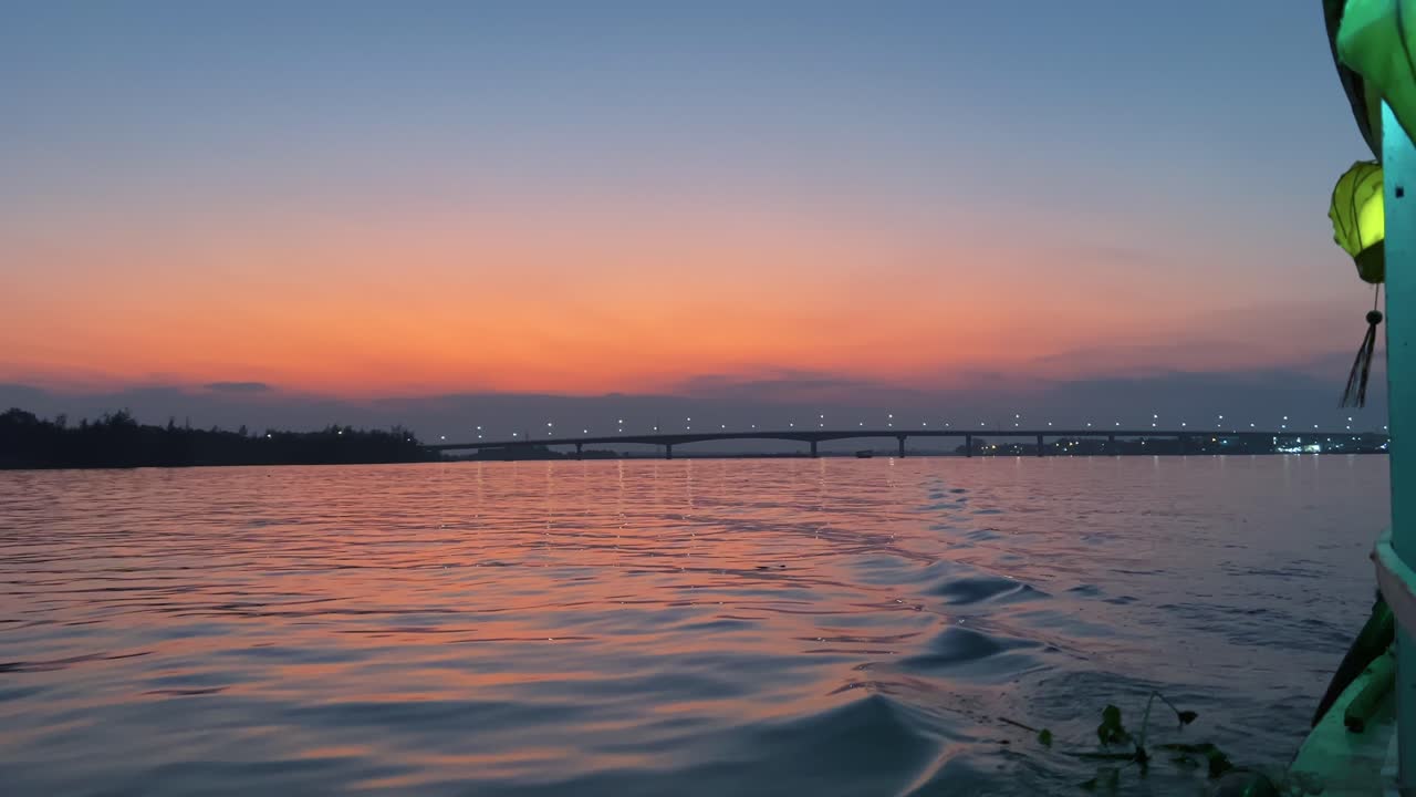 Bridge Over The River Seen From The Boat Sailing At Dusk In Vietnam. - POV, wide shot