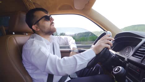 young man in a car.