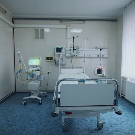 Contemporary reanimation room in clinic. Empty sterile hospital room with modern medical equipment for saving patients lives