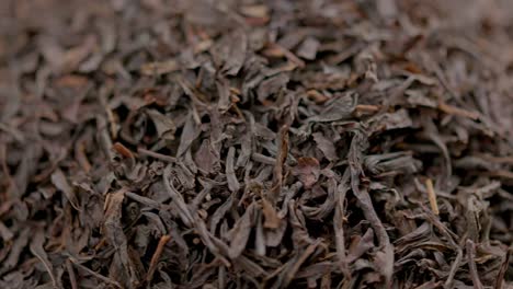 looped spinning dry black tea full frame close-up background