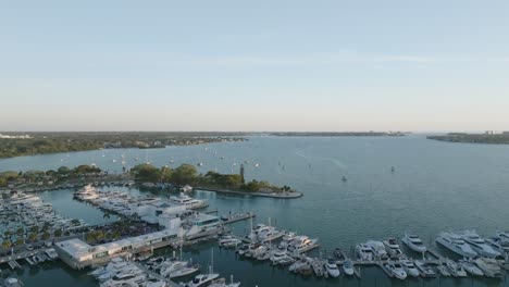 drone footage of freedom boat club at sarasota marina jack, capturing boats docked and anchored in sarasota bay at sunset