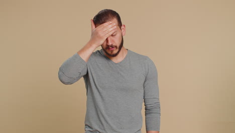 unhealthy lebanese man coughing covering mouth with hand feeling sick allergy or viral infection