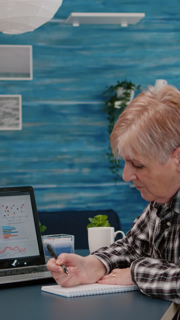 Vertical video: Middle aged senior older woman elearning online concept