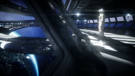 solo astronauta en el corredor espacial futurista, habitación. vista de la tierra. imágenes cinematográficas en 4k.