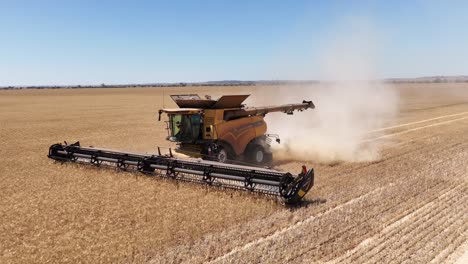 This-footage-captures-the-synergy-of-modern-agricultural-technology,-showcasing-the-essential-role-of-header-fronts-in-the-wheat-harvesting-process