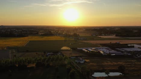 beautiful golden sunset aerial view of serene rural agricultural town