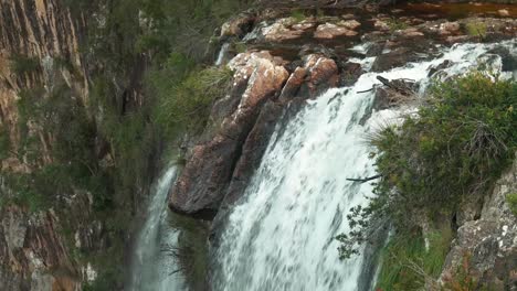 Stunning Waterfall Cascading Over Rocks in Lush Forest