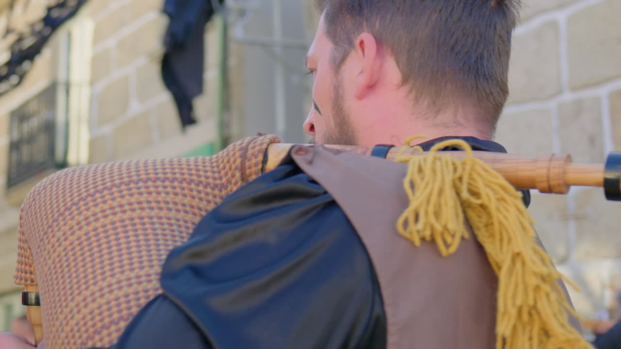 montalegre 13 september 2024 friday the 13th musician playing galician bagpipe in the village centre close shot