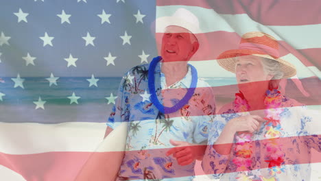 Animation-of-flag-of-usa-over-caucasian-senior-couple-on-beach-in-summer