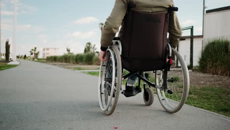 person in wheelchair outdoors