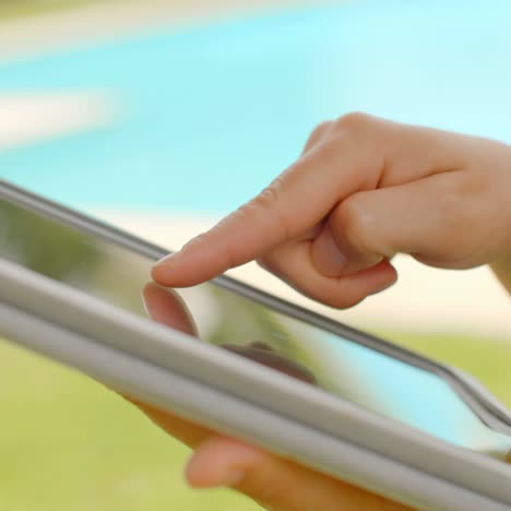 Close-Up-on-Woman-Hands-While-Using-Tablet