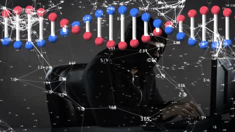 Animation of dna strand and network of data processing over hacker with laptop