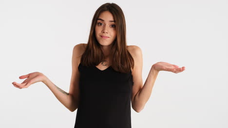 caucasian doubtful woman posing in front of camera.