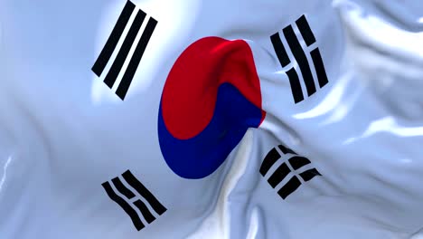 la bandera de corea del sur ondeando en el viento animación en cámara lenta. 4k textura de tela realista bandera soplando suavemente en un día de viento fondo de bucle continuo sin costuras.