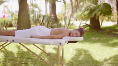 young woman at a tropical outdoor spa