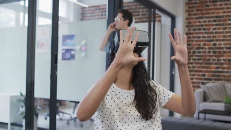 woman using vr headset at office