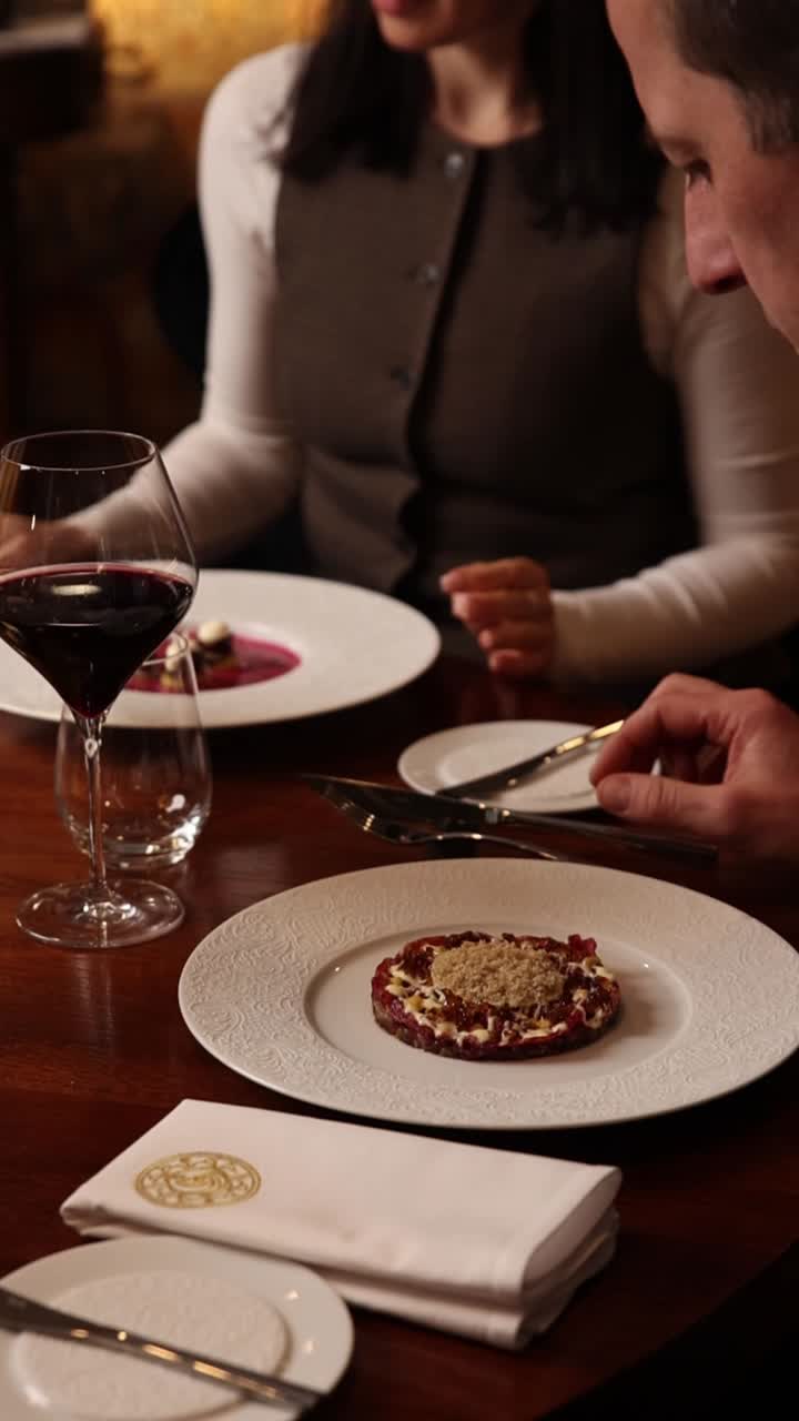 Fine dining with steak tartare and red wine
