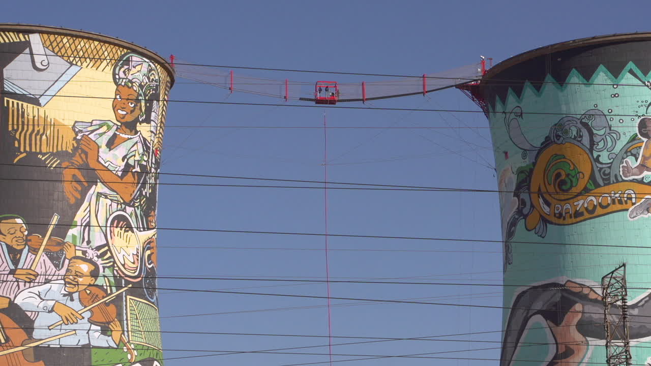 A tourist bungee jumps from a platform at the Orlando cooling towers in the township of Soweto, South Africa.