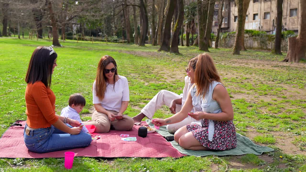 Group of friends enjoying a picnic in the park