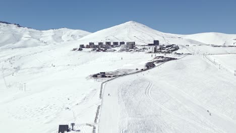 aerial view rising up snow el colorado ski resort drag lift slope to the farellones mountain village properties