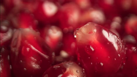 a camera moves over a pile of pomegranate seeds