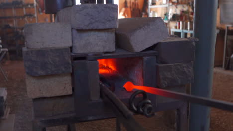 inside blacksmith workshop with kiln on fire