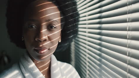 face, window and light with a black woman standing