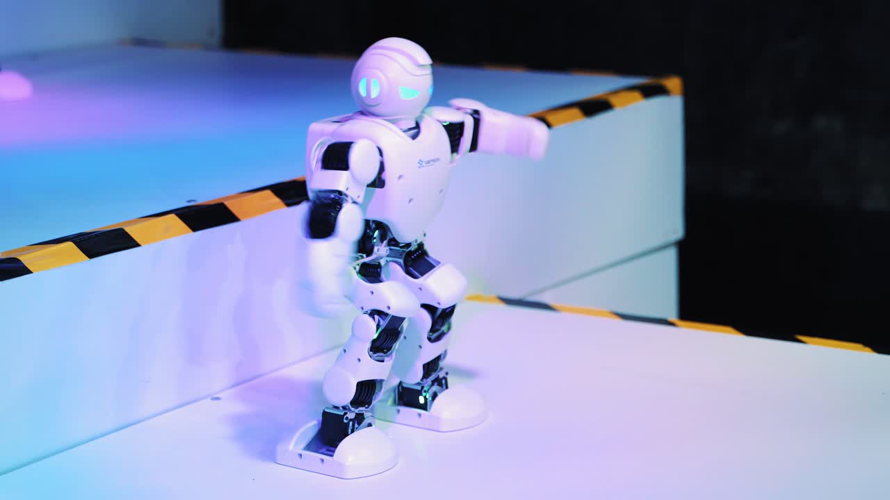 Modern robot toy and an assistant at the exhibition of modern robotics and advanced technologies.