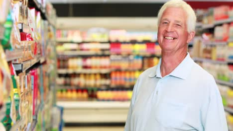 senior man shopping in supermarket